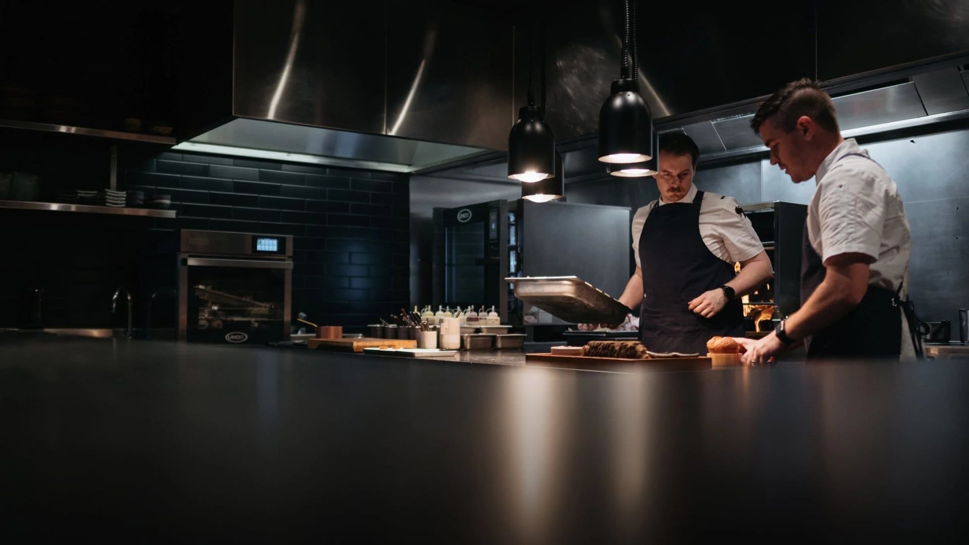 Chefs at the pass in the EXP. Restaurant open kitchen